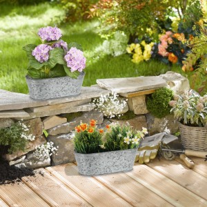 6er Set ovale Zinkwannen von Relaxdays, bepflanzt mit Blumen, als Gartendeko.