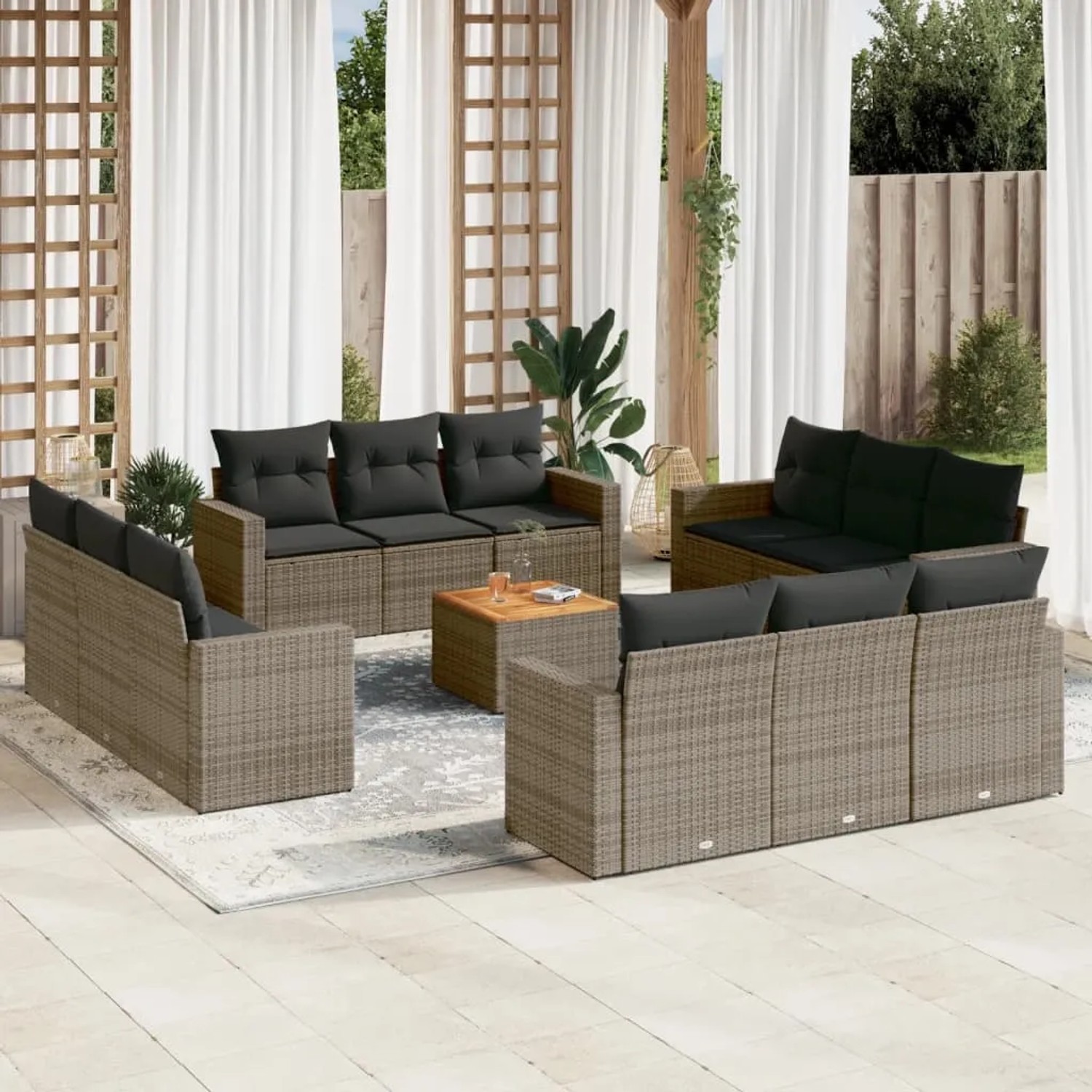 13-tlg. Garten-Sofagarnitur aus grauem Poly Rattan mit Kissen und Tisch.
