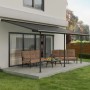 Canopia Terrassenüberdachung Capri, 610x300 cm, anthrazitgrau, mit Gartenmöbeln auf Terrasse.