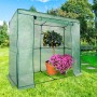 Grünes KARAT Gewächshaus Botanika 1,6 m² mit Pflanzen. Eckiges Foliengewächshaus für große Pflanzen im Garten.