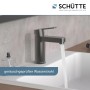 Schütte Waschtischarmatur Elephant, Graphit matt, mit laufendem Wasser im Waschbecken.