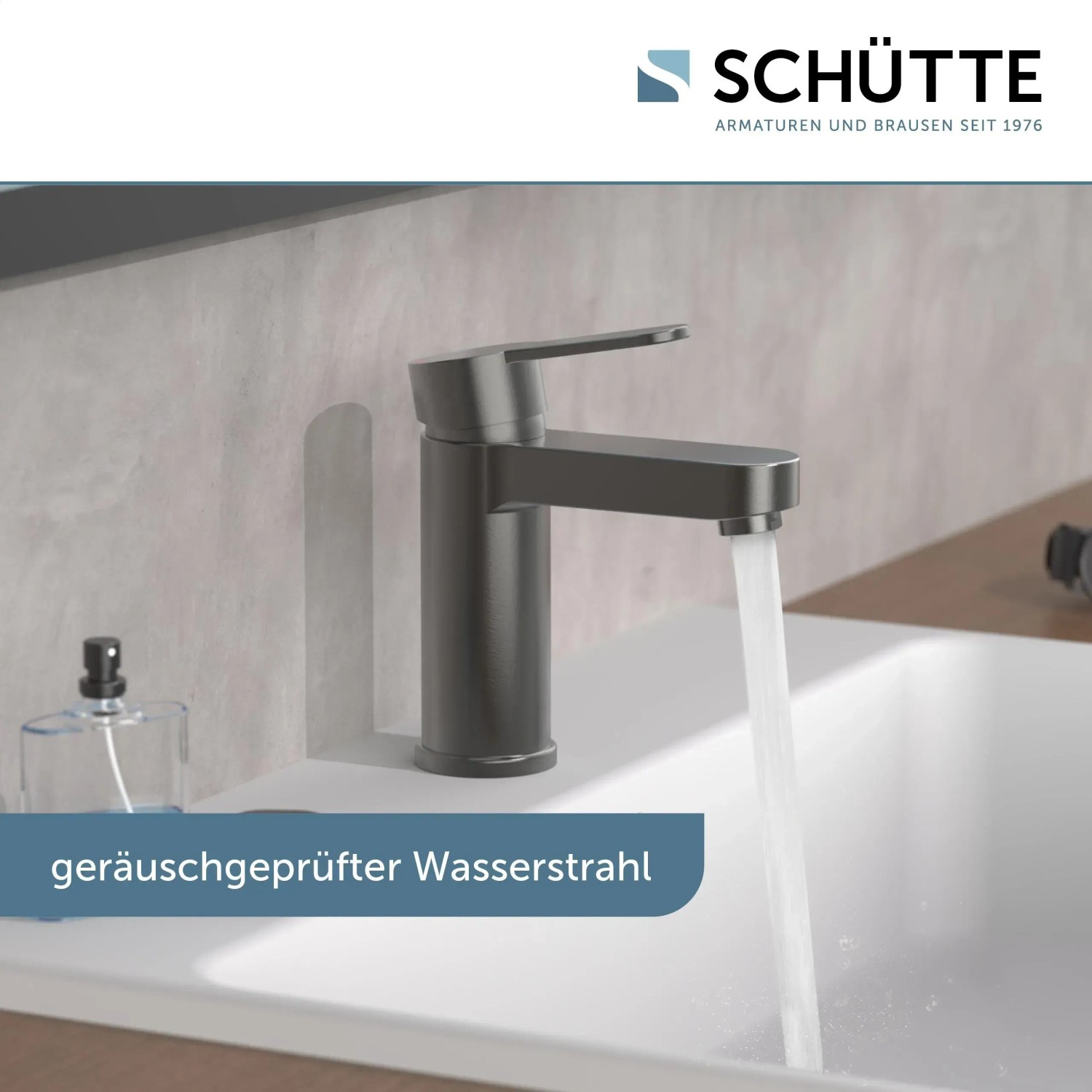 Schütte Waschtischarmatur Elephant, Graphit matt, mit laufendem Wasser im Waschbecken.