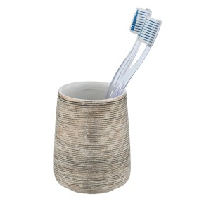 Goldener Wenko Zahnputzbecher Fedio aus Keramik mit zwei Zahnbürsten.