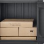Offene, anthrazitfarbene Floraworld Paketbox aus Stahl mit mehreren Paketen im Inneren.