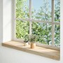 Zwei unbehandelte Eiche Massivholz Fensterbänke (80x20x2 cm) mit Deko auf einem Fensterbrett.