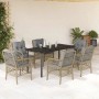 7-tlg. Garten-Essgruppe mit beigen Poly Rattan Stühlen und schwarzem Tisch mit Glasplatte.