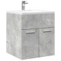 Waschbeckenschrank in Betongrau mit zwei Türen und Waschbecken.
