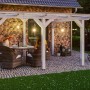 Freistehende, weiße Skan Holz Terrassenüberdachung Siena aus Leimholz mit klarer Dacheindeckung.