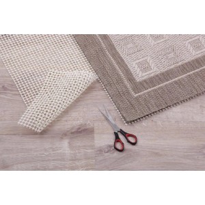 ProHome Teppich Gleitschutz (80x150 cm) mit Schere und Teppich auf Holzboden.
