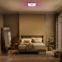 Ledvance Smart+ WiFi Panelleuchte Planon Plus mit farbigem Rücklicht in einem Schlafzimmer.