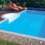Steinbach Styropor Pool-Set Highlight de Luxe, 800x400x145 cm, mit Poolleiter und Liegen im Garten.