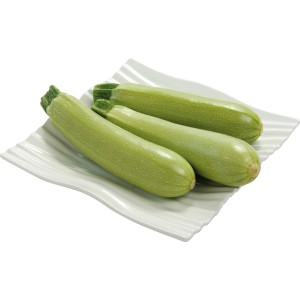 Helle Zucchini auf einem Teller, Grow by OBI, ideal für Gemüsebeete und den Frischverzehr.