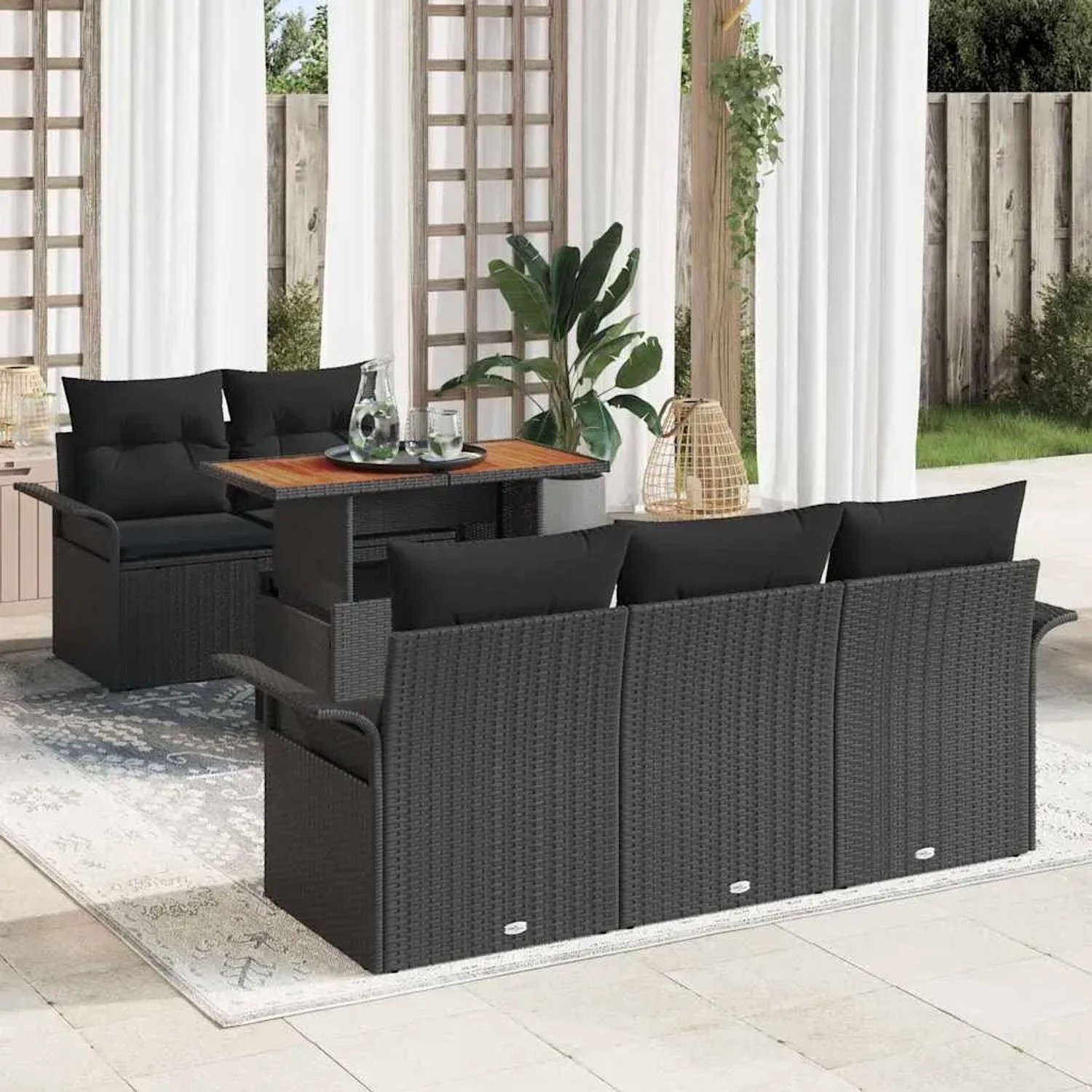 Schwarzes 6-teiliges Garten-Sofa-Set aus Poly Rattan mit Tisch und Stauraum.
