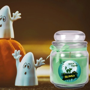 Grüne Halloween Duftkerze im Glas (70h) mit Geister-Deko. Stumpenkerze für stimmungsvolle Herbstabende.