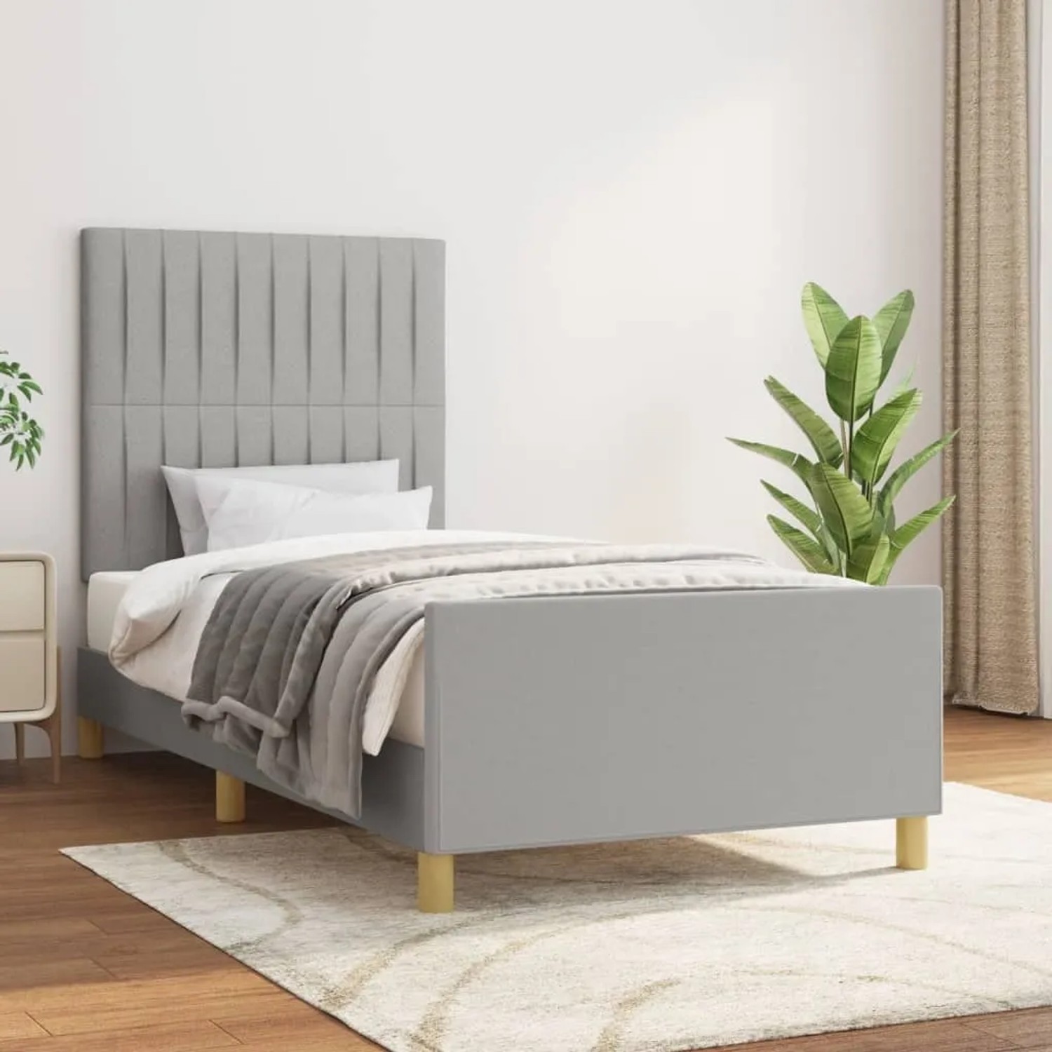 Hellgraues Stoff-Bettgestell 90x200 cm mit Kopfteil für erholsamen Schlaf im Schlafzimmer.