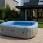 Aufblasbarer, eckiger MCW Whirlpool N97 für 6 Personen in Grau-Blau im Garten.
