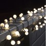 Konstsmide LED-Lichterkette mit runden, warmweißen Globe-Leuchten für den Außenbereich.