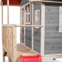 Graues EXIT Loft 350 Holzspielhaus mit Anbau, Rutsche und Geländer.