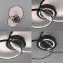 Moderne, schwarze LED-Deckenleuchte Asmina mit verschlungenen Ringen, warmweißes Licht.