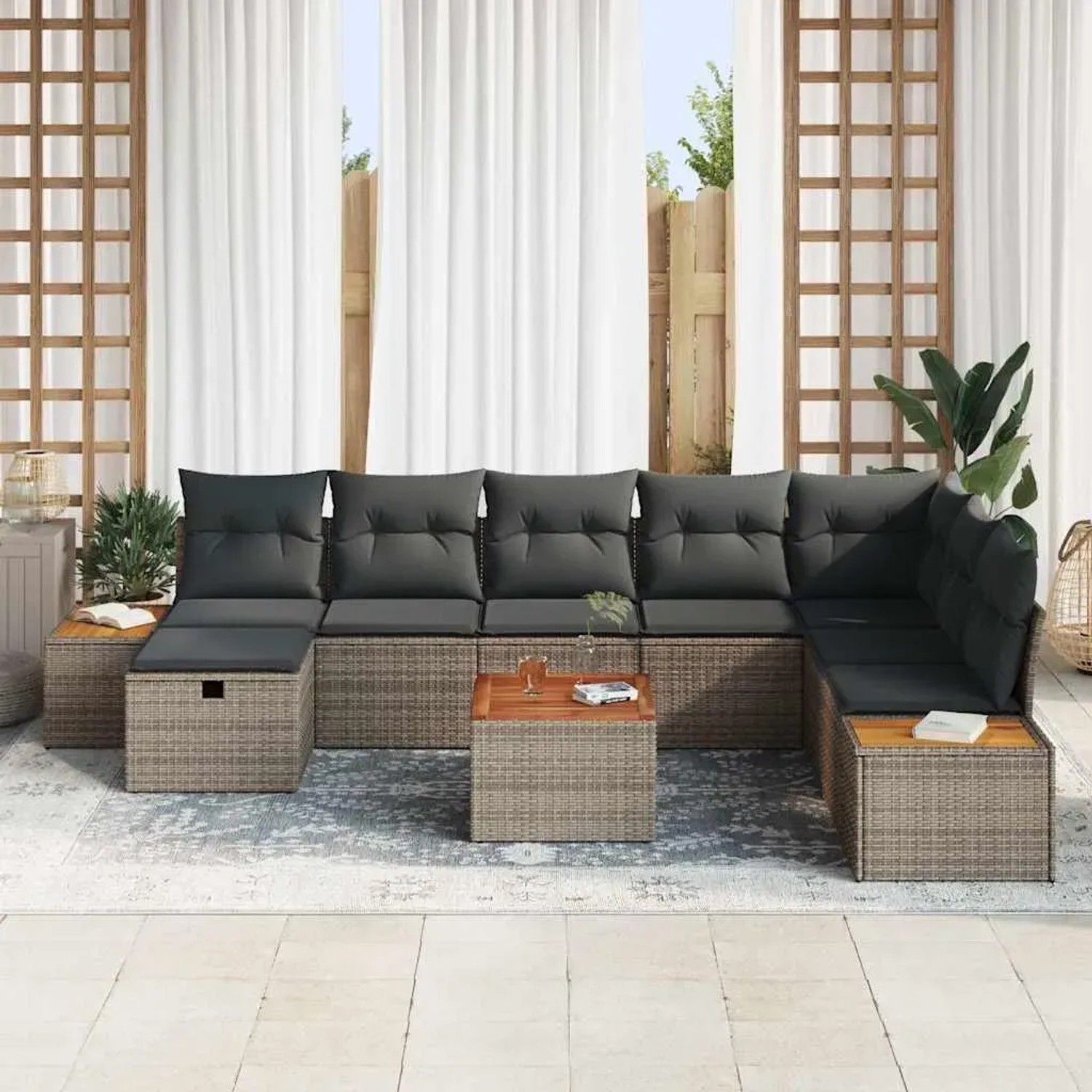 Graues 9-teiliges Garten-Sofa-Set aus Poly Rattan mit Kissen und Stauraum.