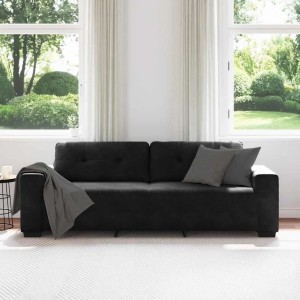 Schwarzes 3-Sitzer Samt-Sofa mit Kissen und Decke in hellem Wohnzimmer. Modernes Design für Komfort.
