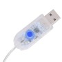 Transparenter USB-Stecker mit blauem Bedienknopf für den vidaXL LED-Lichtervorhang. Steuerung der 8 Lichtfunktionen.