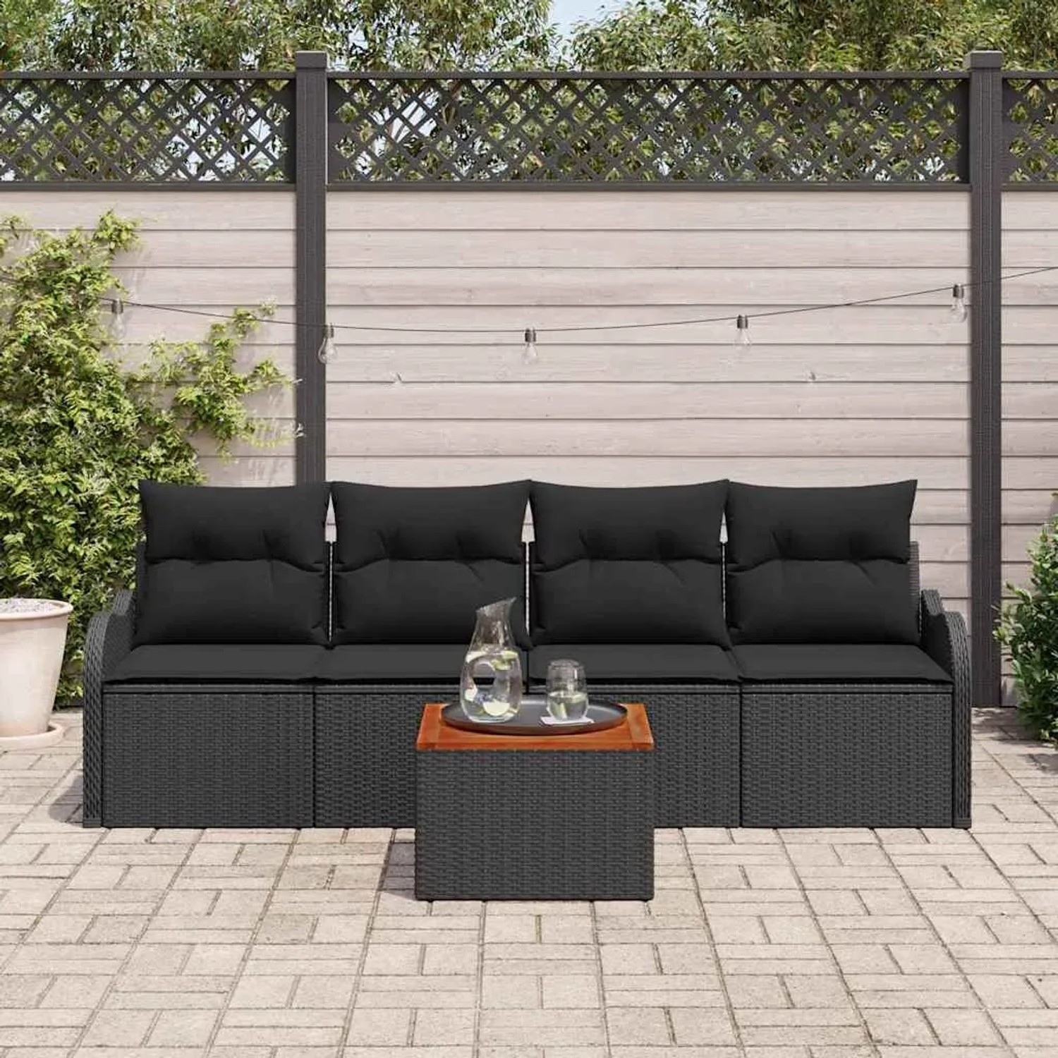 Schwarzes 5-teiliges vidaXL Garten-Sofa-Set aus Poly Rattan mit Tisch und Stauraum.