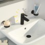 Schwarze Grohe QuickFix Waschtischarmatur Start S-Size auf weißem Waschbecken mit Seife und Zahnbürste.