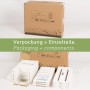 Verpackung und Einzelteile des needs&wants Multi Pflanzenständer Placy1 aus Holz.