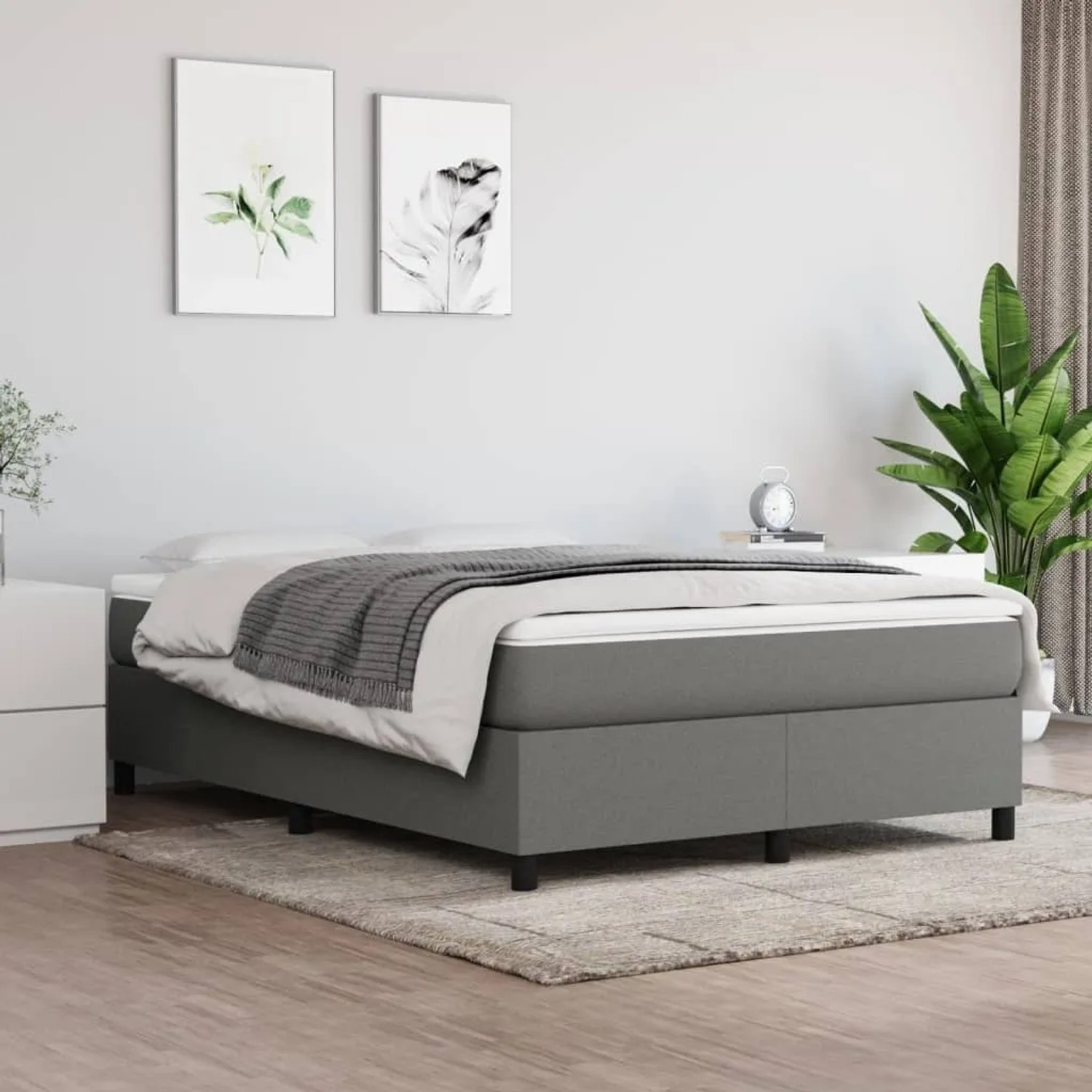 Dunkelgraues vidaXL Boxspringbett (140x200 cm) mit Stoffbezug im Schlafzimmer.