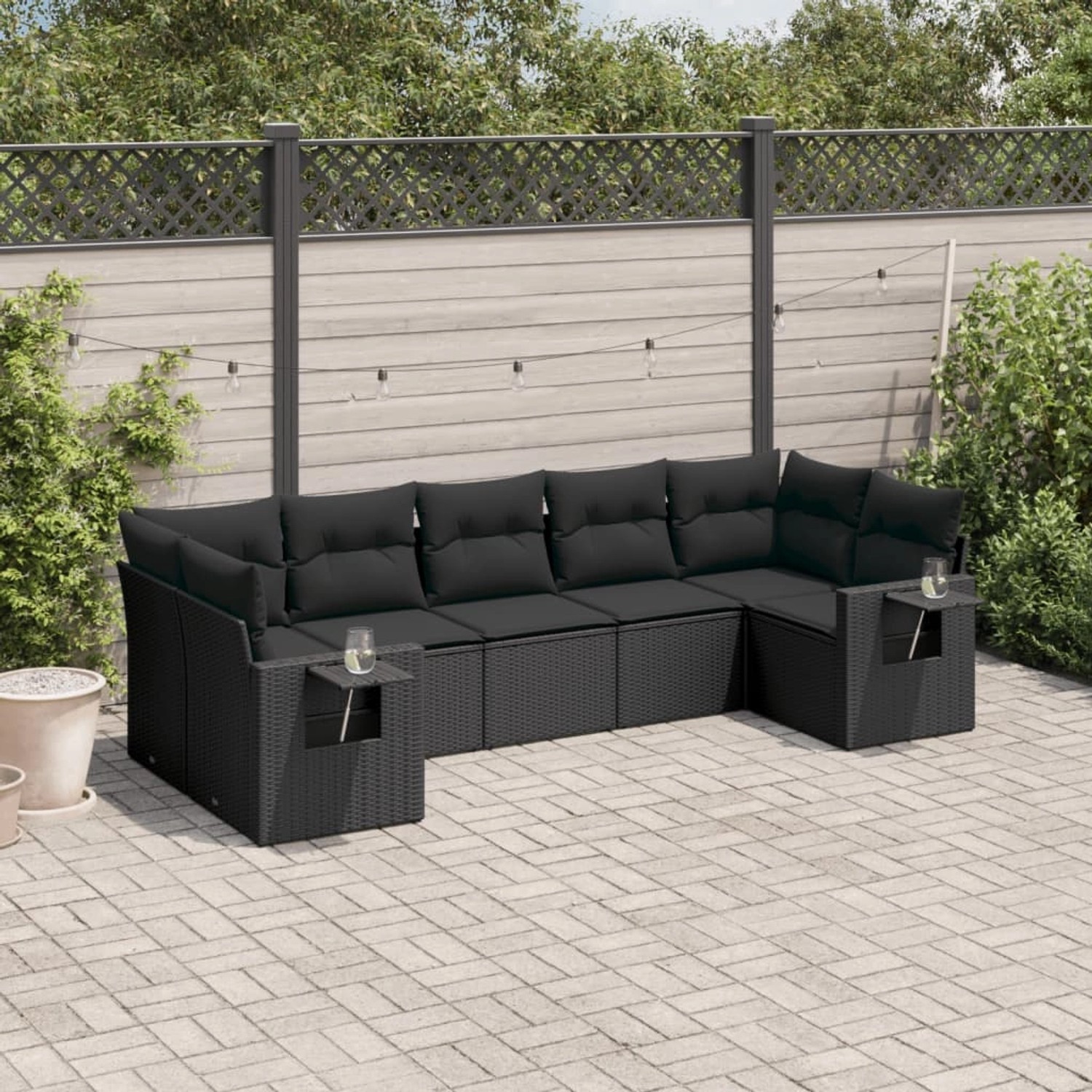 Schwarze 7-tlg. vidaXL Garten-Sofagarnitur aus Poly Rattan mit Kissen.