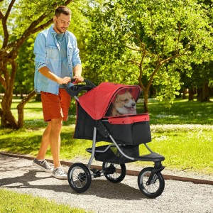 Mann schiebt roten PawHut Hundewagen mit Hund im Park. Ideal für Spaziergänge mit Ihrem Vierbeiner.