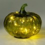 Grüne Kürbis Glaslampe mit warm leuchtenden LEDs. Dekorative Figur für festliche Herbst- und Halloween-Stimmung.