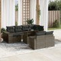 11-teilige graue Garten-Sofagarnitur aus Polyrattan mit Tisch und Kissen.