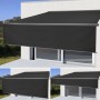 Anthrazitgraue MCW Kassettenmarkise 4x3m mit Volant ausgefahren vor Fenster.