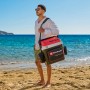 Einhell Akku-Kühlbox TE-COL 18/27 Li-Solo am Strand mit Tragegurt. Ideal für unterwegs.