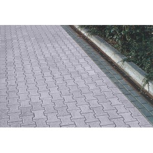 Verbundpflaster Beton Doppel-T Endstein, graue Pflastersteine im Doppel-T-Verbund verlegt.