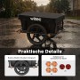 Schwarzer Wiltec Fahrrad Lastenanhänger im Regen, mit breiten Reifen und Reflektoren für sicheren Transport.