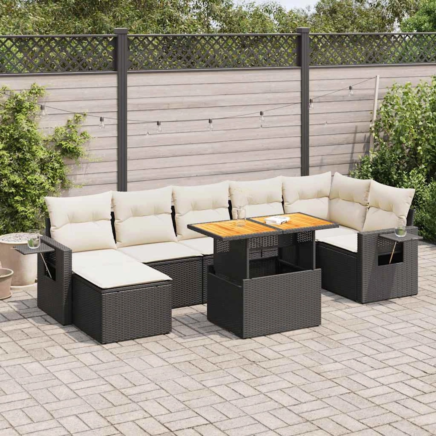 Schwarze 8-tlg. vidaXL Garten-Sofagarnitur aus Poly Rattan mit cremefarbenen Kissen.