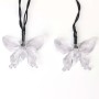 Zwei transparente Schmetterling-LEDs einer Solar-Lichterkette für Garten & Außenbereich.