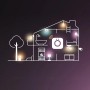 Haus-Illustration mit Philips Hue Beleuchtung in verschiedenen Räumen und im Garten.