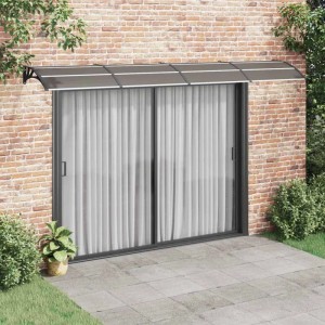 Schwarzes vidaXL Türvordach 400x100 cm aus Polycarbonat über einer Terrassentür.