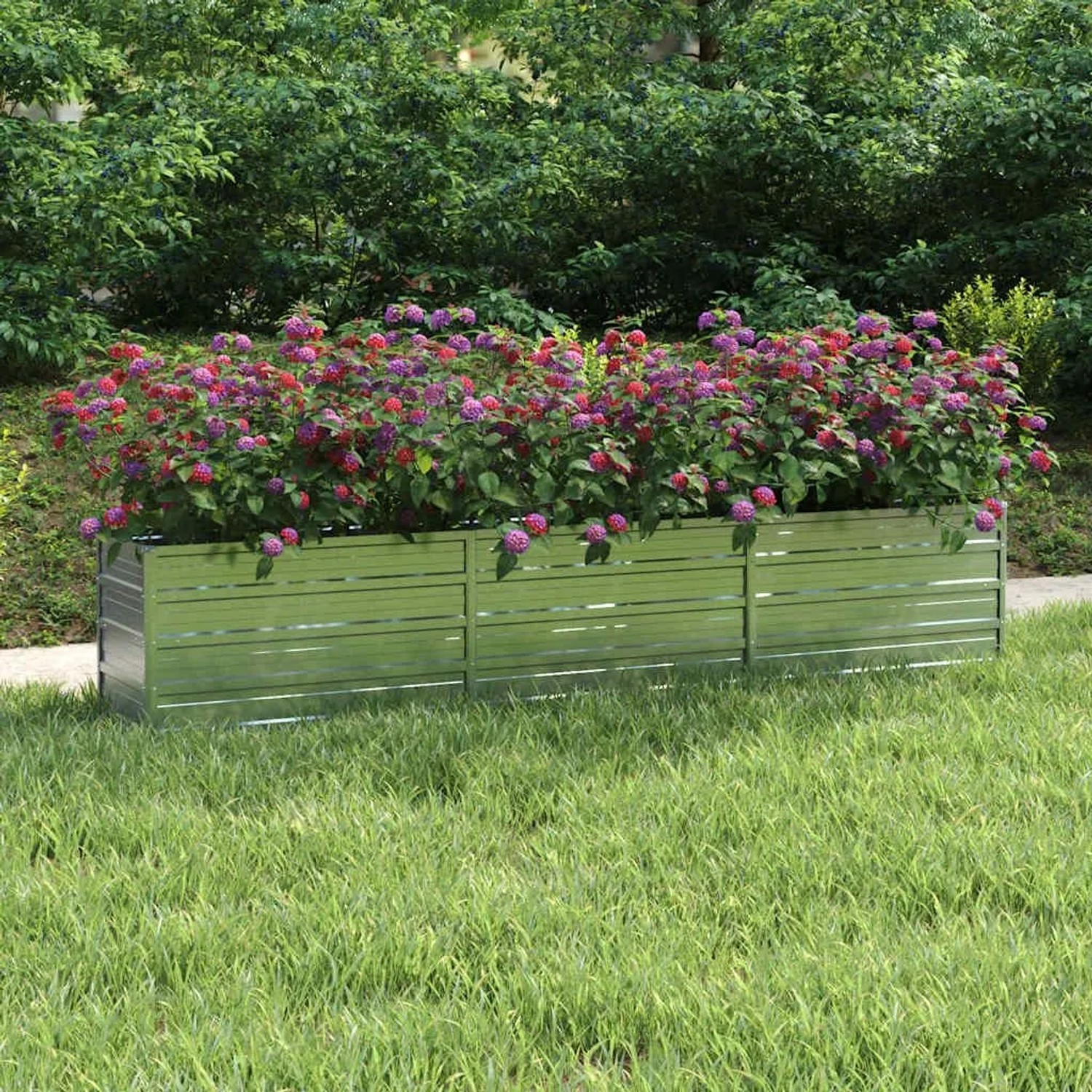 Silbernes furnicato Garten-Hochbeet aus verzinktem Stahl, bepflanzt mit bunten Blumen.