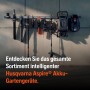 Husqvarna Aspire Akku-Gartengeräte an einer Schiene: Heckenschere, Rasentrimmer, Grasschere, Mähroboter.
