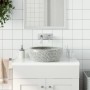 Graues, rundes Keramik Aufsatzwaschbecken mit gesprenkeltem Muster auf Waschtischplatte im modernen Bad.