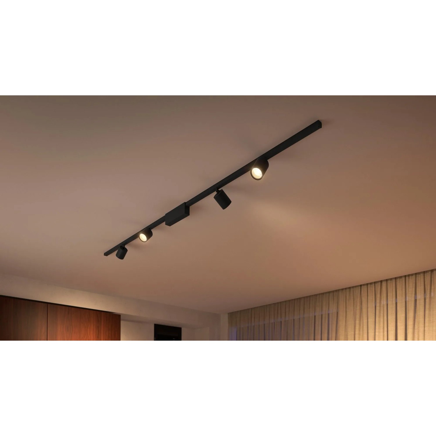 Schwarze Philips Hue Perifo LED-Spots als Schienensystem-Erweiterung an der Decke.