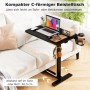 Schwarzer Costway Pflegetisch mit Rollen als Betttisch neben Sofa mit Laptop und Zubehör.