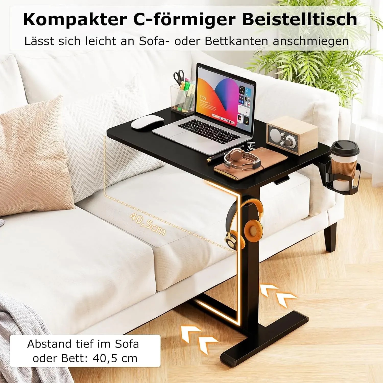 Schwarzer Costway Pflegetisch mit Rollen als Betttisch neben Sofa mit Laptop und Zubehör.