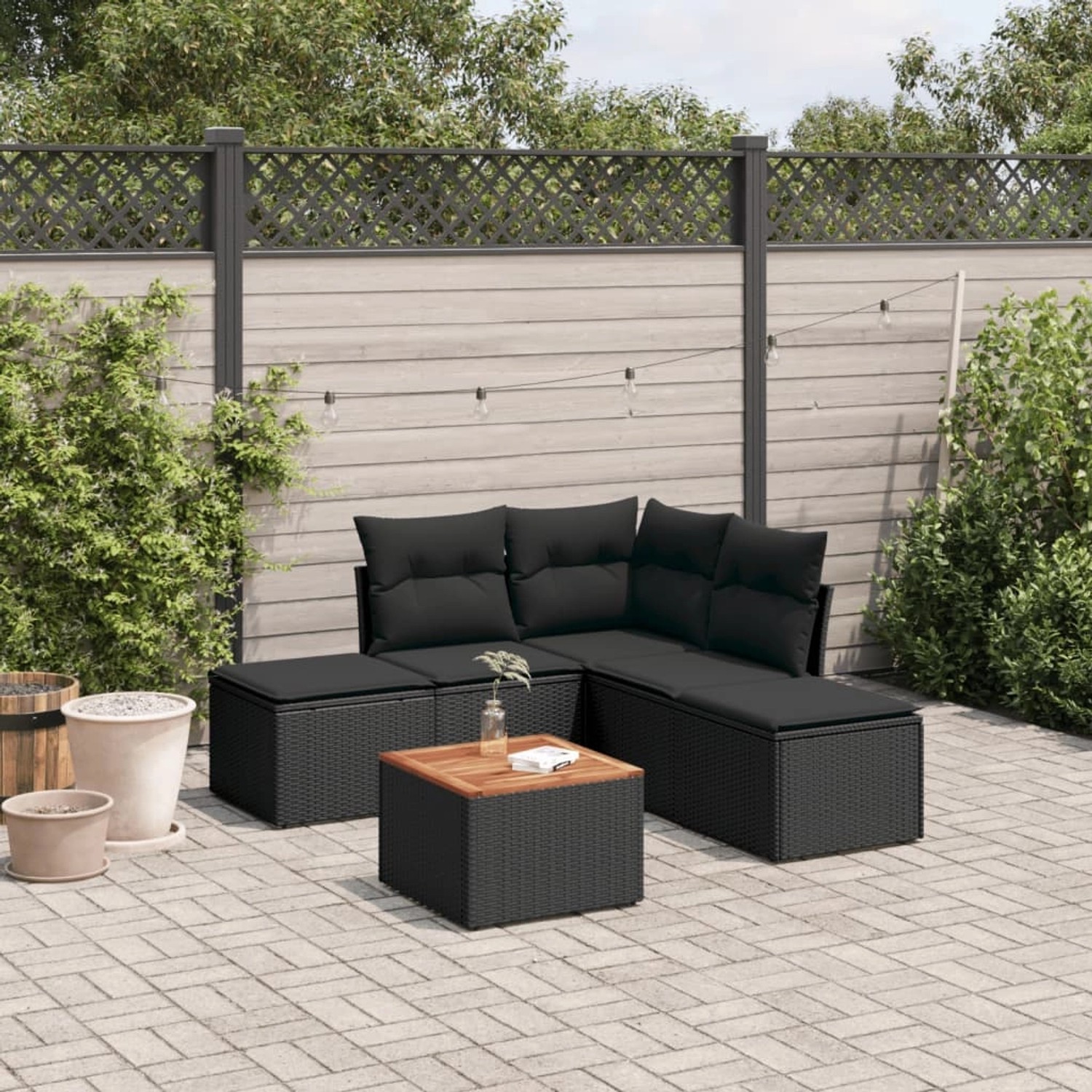 Schwarze 6-tlg. vidaXL Garten-Sofagarnitur aus Poly Rattan mit Kissen.