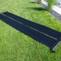 Steinbach Speed Solar Sun Kollektoren auf Rasen, zur Pool-Erwärmung.